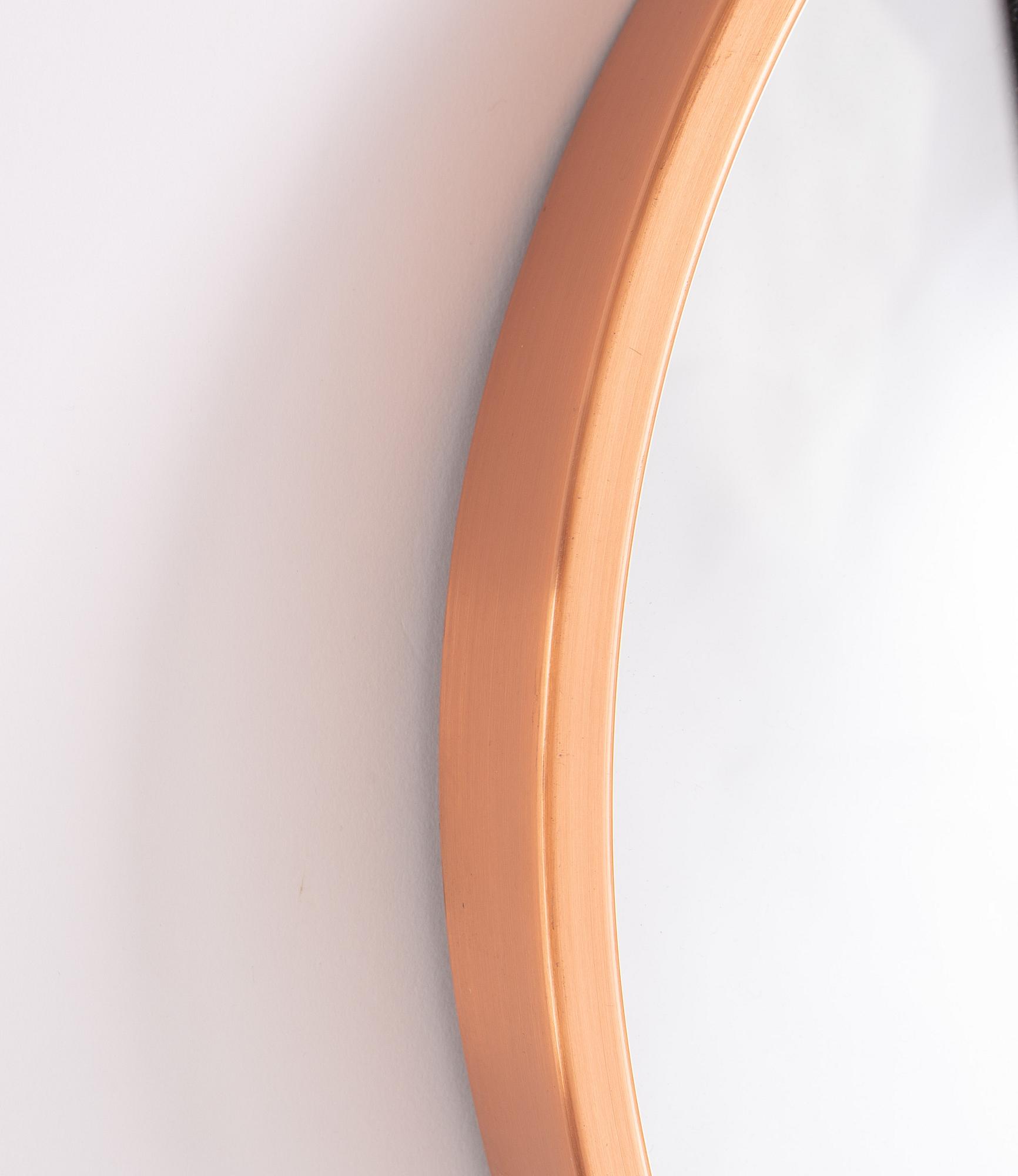 A copper ceiling lamp, by Fog & Mørup, Denmark, and a copper mirror, Markaryd.