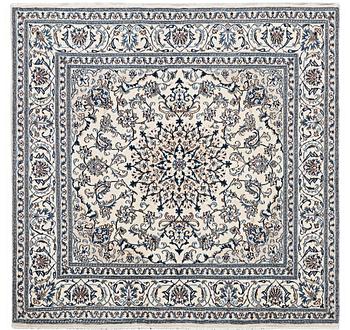 A rug, Nain, part silk, 9 laa, c. 202 x 199 cm.