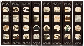 A set of eight panels with 32 dreamstone plaques, late Qing dynasty (1644-1912).