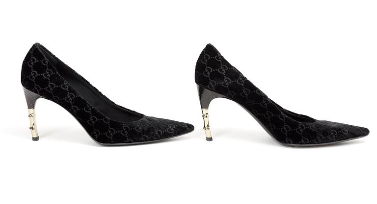 A pair of lady shoes by Gucci.