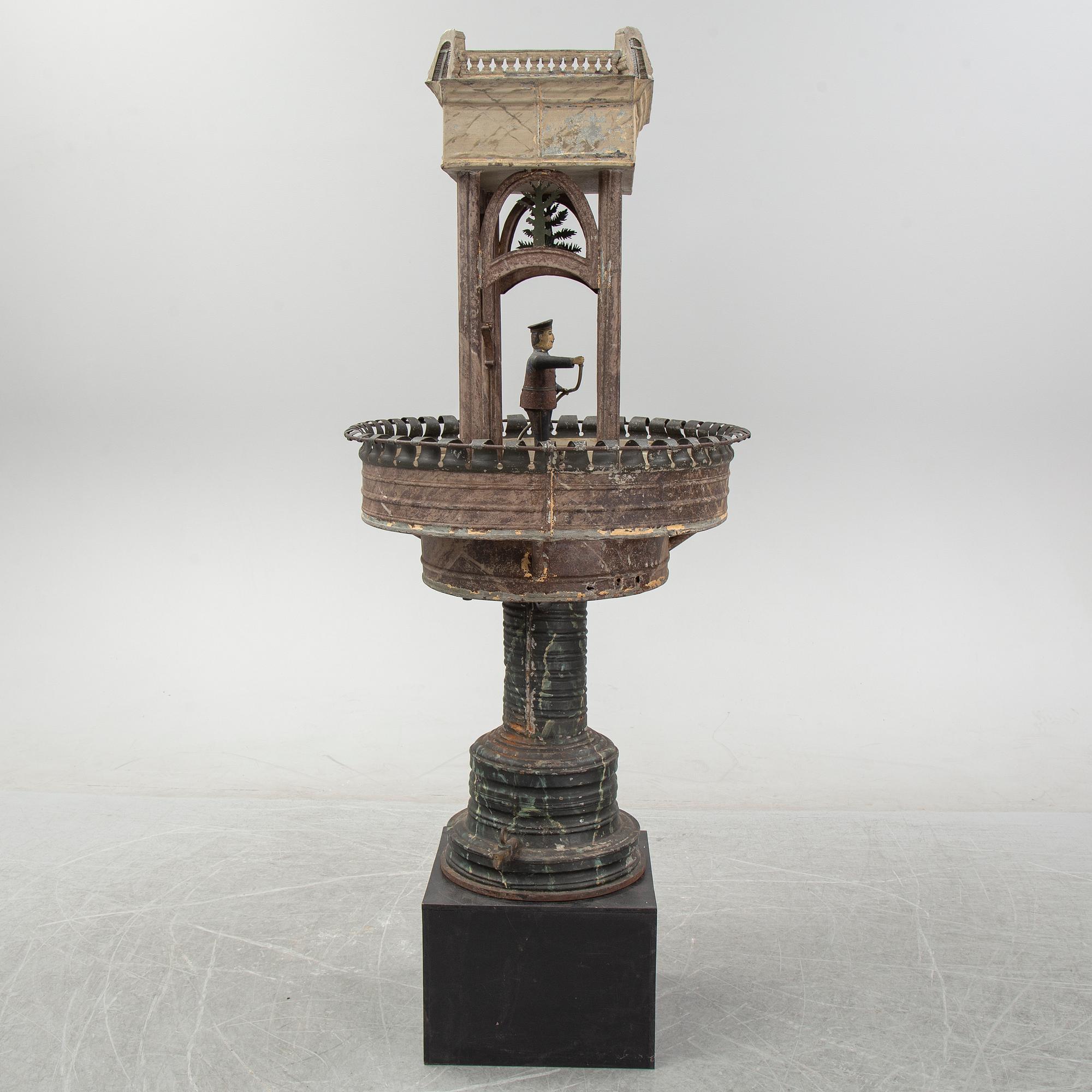 A painted and richly decorated plate garden fountain, late 19th century.