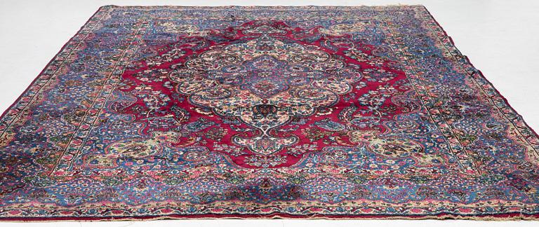A Kerman carpet, c. 365 x 265 cm.