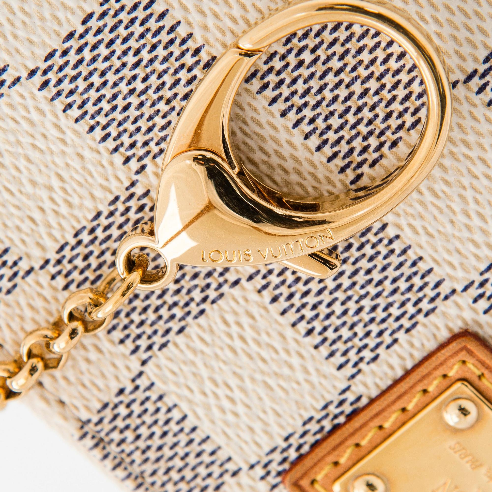 Louis Vuitton, a Damier Azur 'Milla MM Pochette' bag.