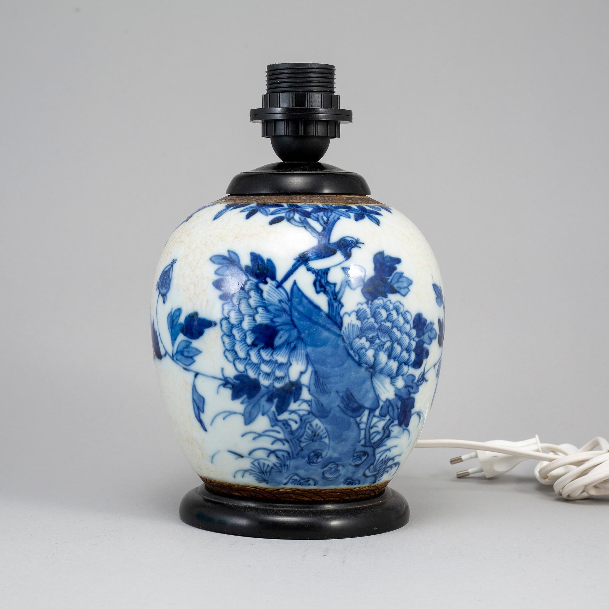 A blue and white jar made in to a lamp, China, early 20th Century.