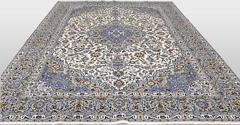 A Keshan carpet, signed, 386 x 281 cm.