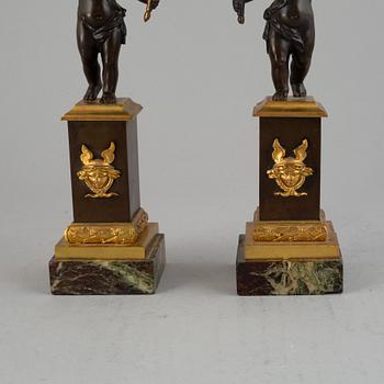 A pair of bronze empire style candleabra, 20th century.
