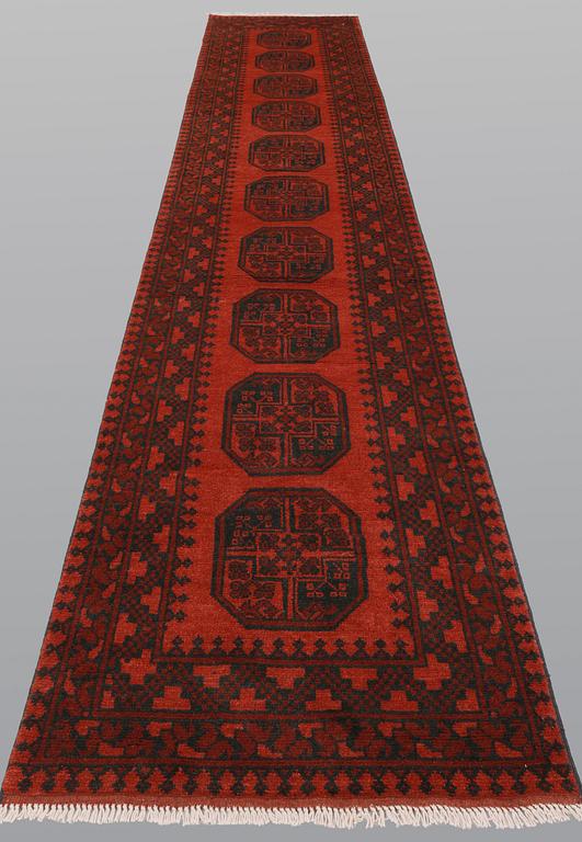 An Afghan runner, ca 383 x 78 cm.