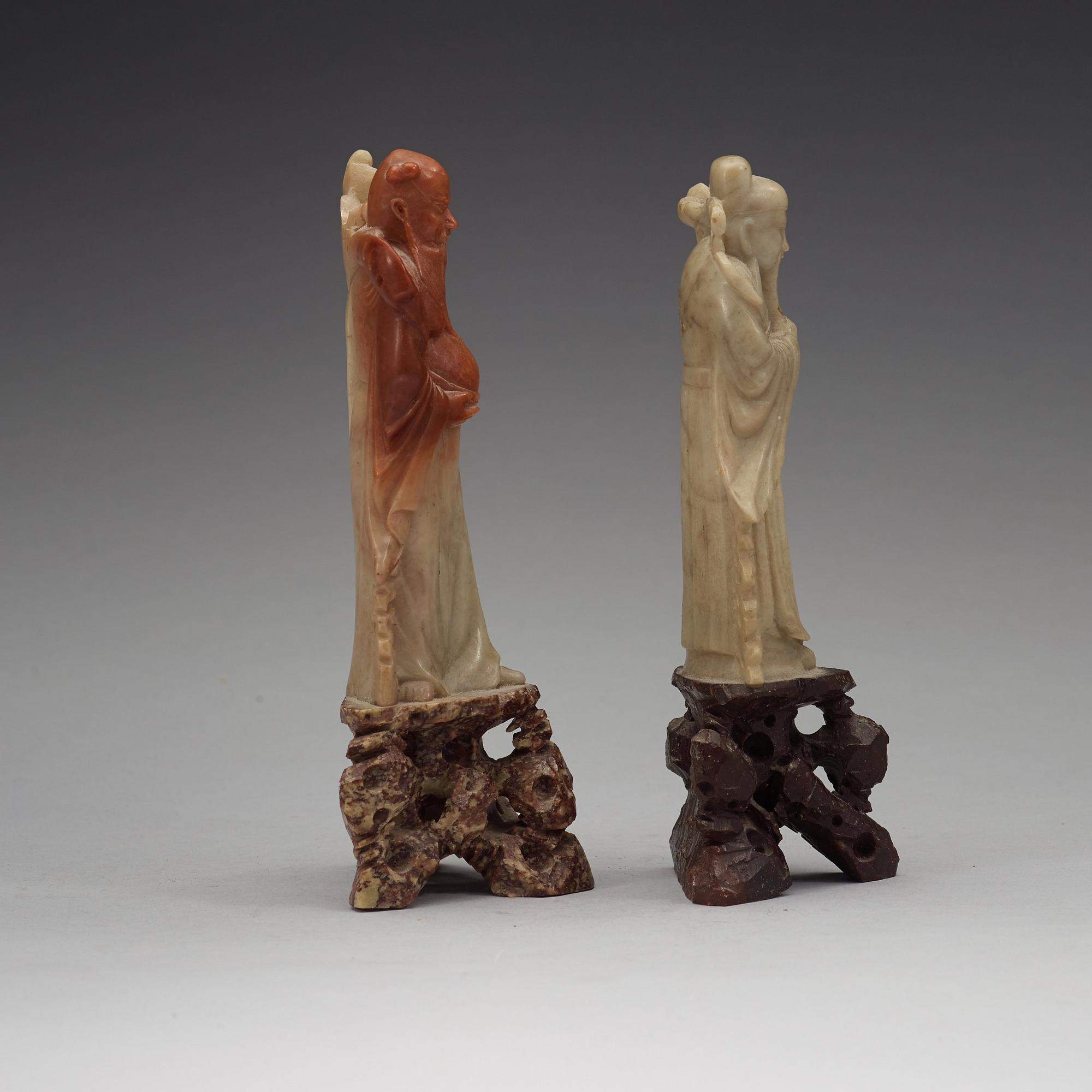 Two soapstone sculptures of immortals, late Qing dynasty, 19th Century.
