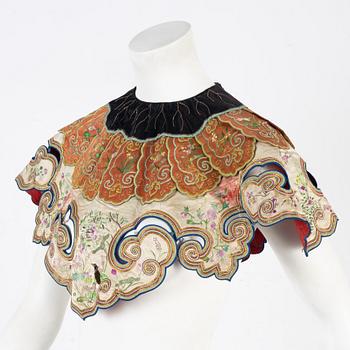 A collar a vest and two Chinese embroidered silk textiles, late Qing dynasty / early 20th century.