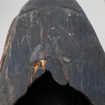 Four Tibetan/South East Asian wooden decorations, 20th century.