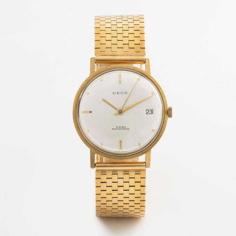 Deco, 18k wristwatch with bracelet in 18K gold, 34 mm.