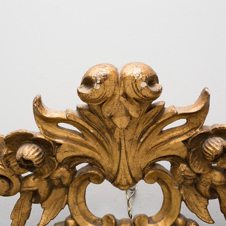 A late 19th century gilt rokoko style carved wooden ornament.