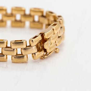 An 18K gold bracelet, diamonds totalling approximately 0.75 ct. Foreign hallmarks.