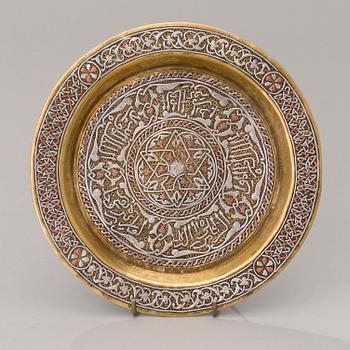 A Middle Eastern brass, silver and copper plate ca 1900.