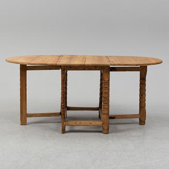 A 19th century pine gate leg table.