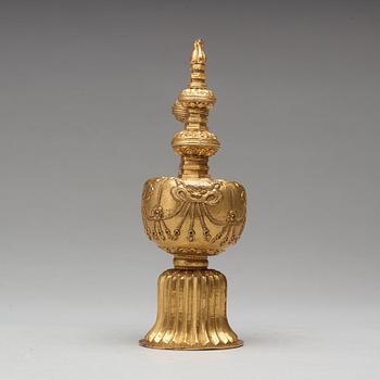 A Tibetan gilt copper bumpa, 19th Century.