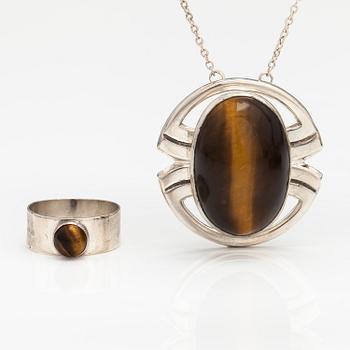 A silver ring and necklace with tiger's eye. Kultasepät Salovaara, Turku 1961.