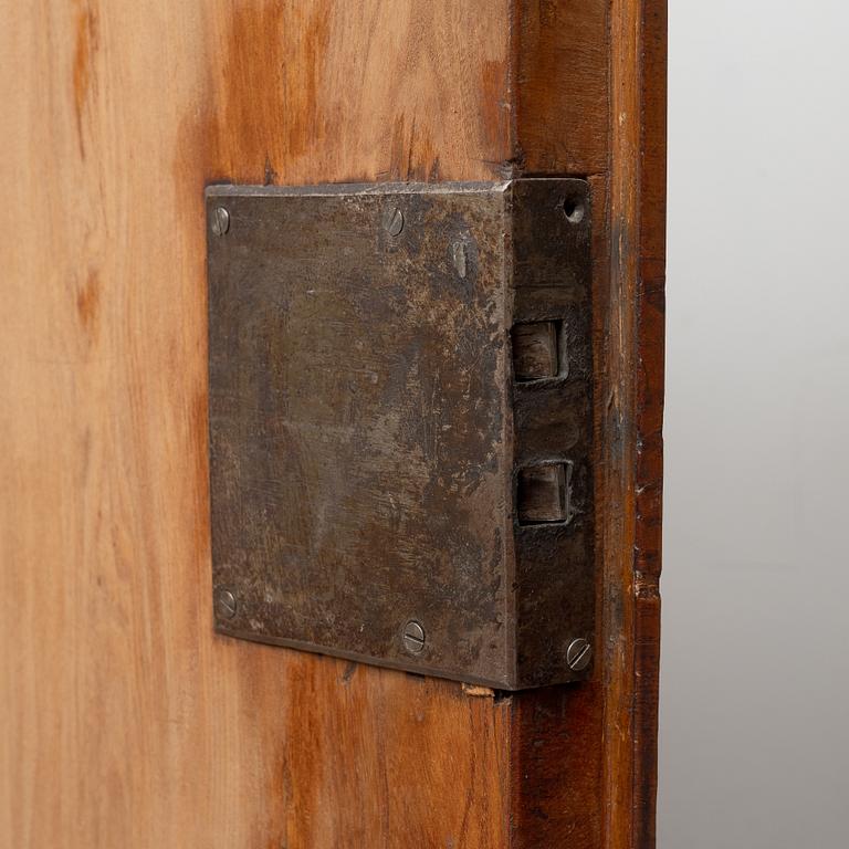 A late Baroque walnut-veneered cabinet in the manner of J. H. Fürloh, mid 18th century.