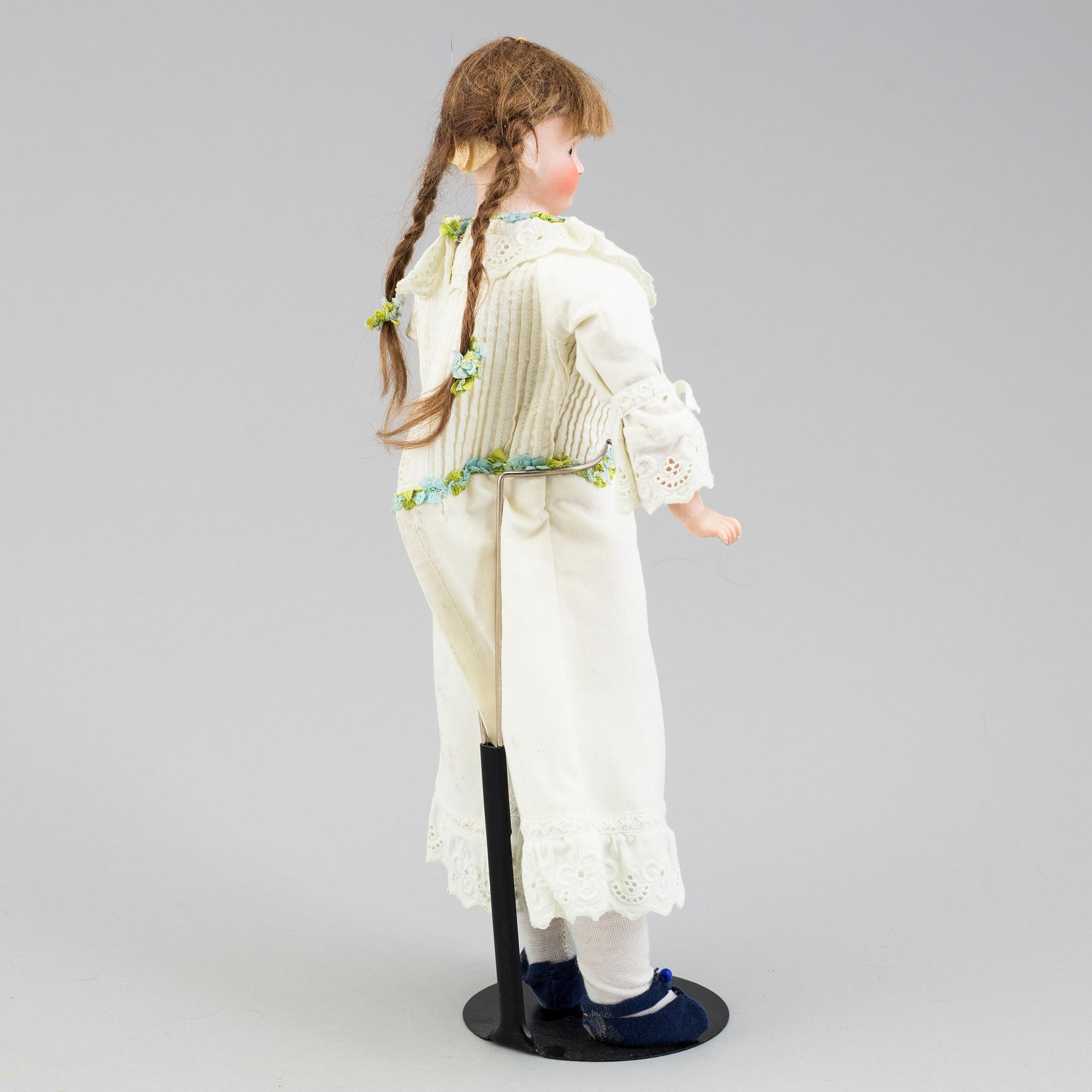 a German porcelain doll from the early 20th century.