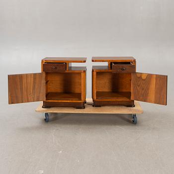 A pair of walnut/mahogany bedside tables first half of the 20th century.