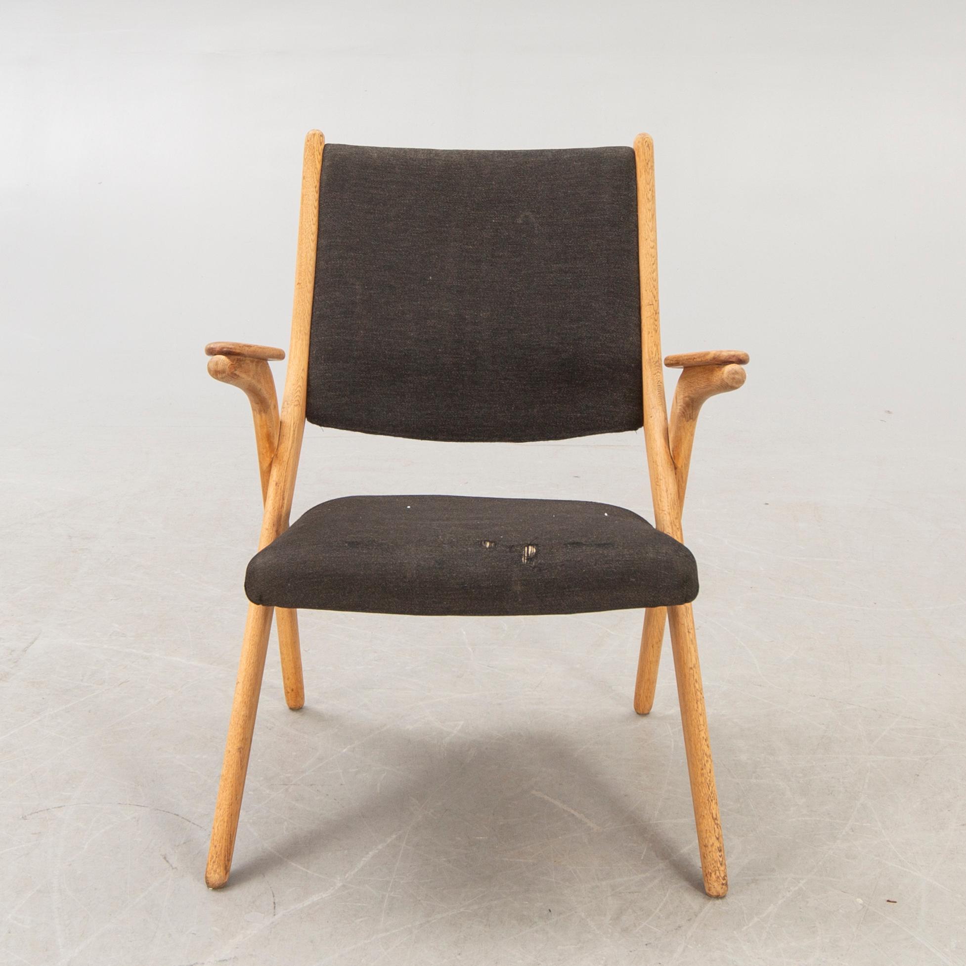 A Swedish oak and teak mid 1900s easy chair.