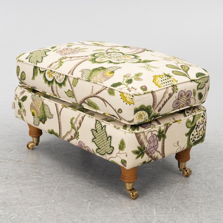 A 'Howard' armchair with footstool, Englesson.