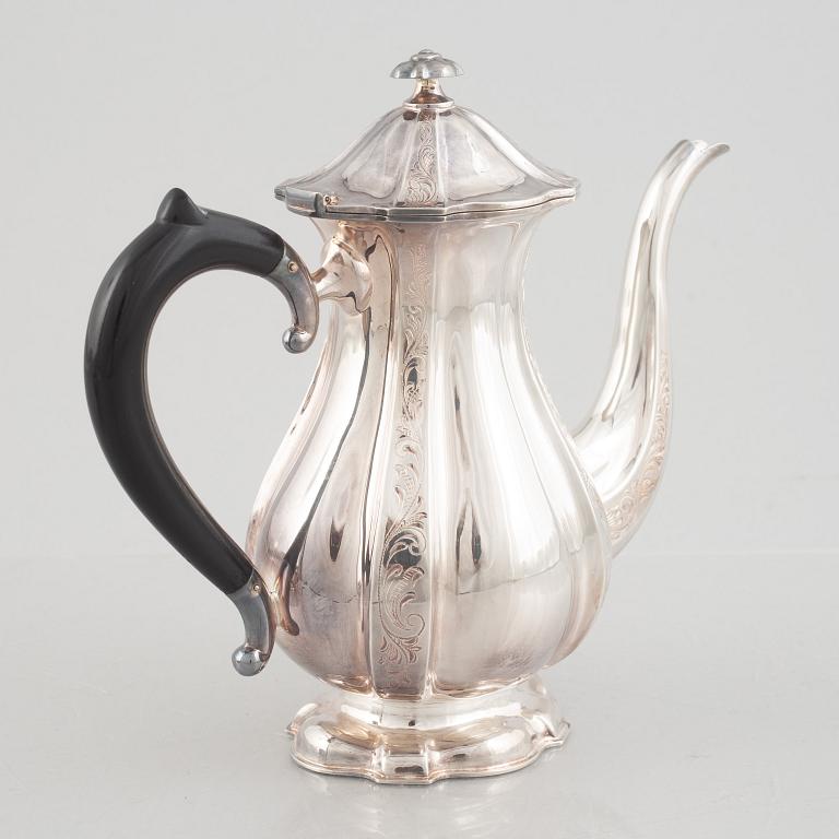 A silver coffee pot, creamer and sugarbowl, Swedish import marks, JL Hultman, circa mid-20th century.
