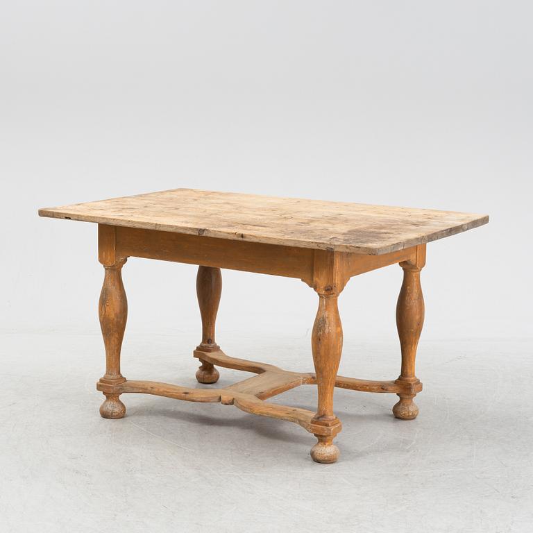 A pine Baroque style dining table, 19th Century.