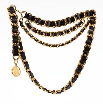 A Chanel golden chain belt.