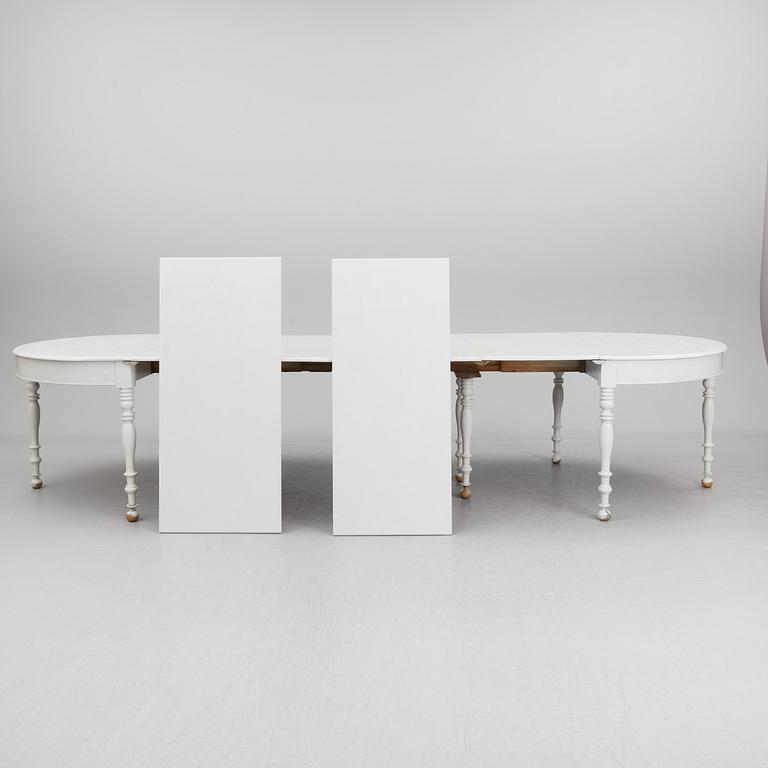 A mid 19th century dining table with six extension leaves.