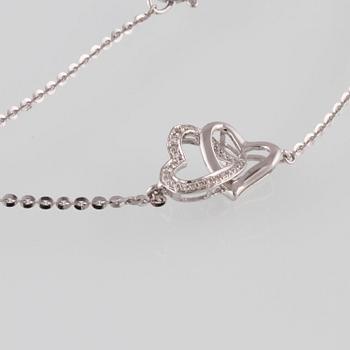 ARMBAND, 18K vitguld med briljantslipade diamanter ca 0.07 ct. Vikt 2,0 gram.
