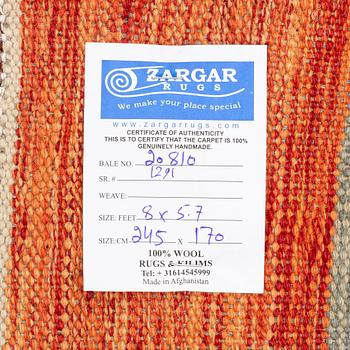 A Kilim rug, c. 245 x 170 cm.