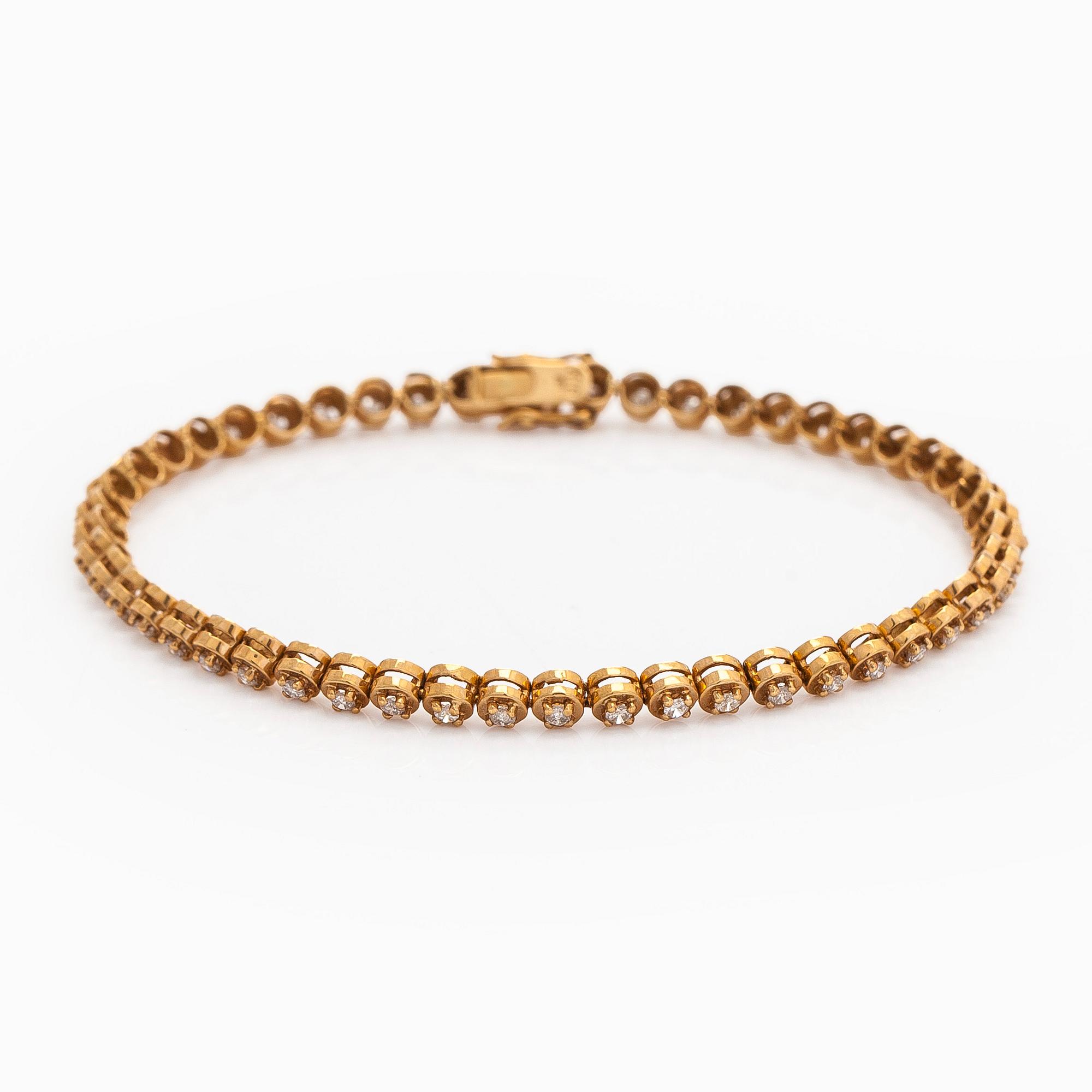 Armband, 18K guld och briljantslipade diamanter.