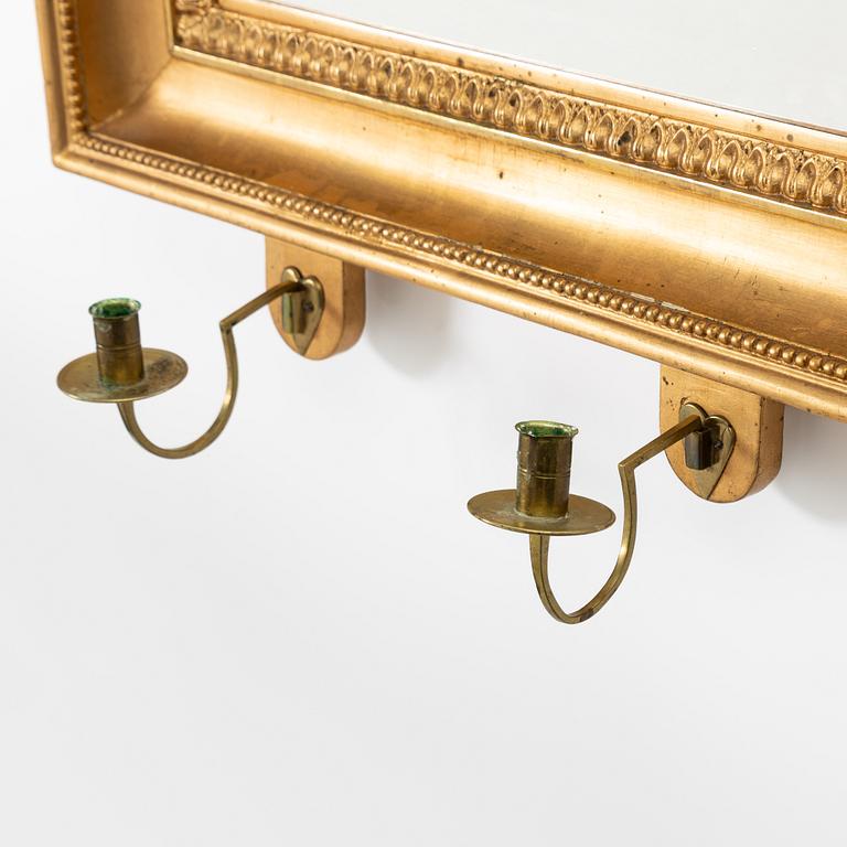 A pair of Late Empire gilded mirror sconces for two candles, Gothenburg, 1830s-40s.