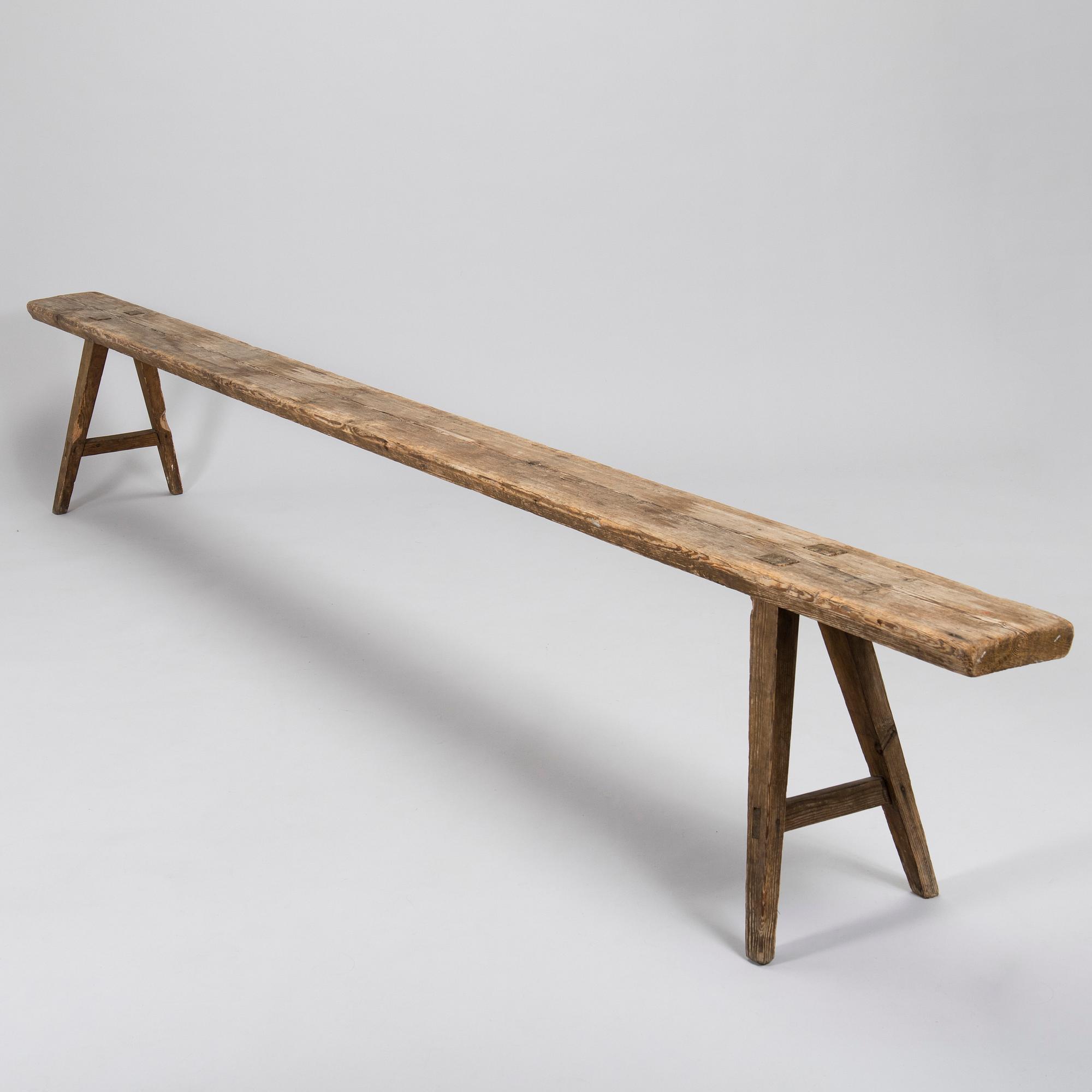 A folk art bench, circa 1900.
