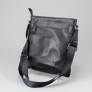 LOUIS VUITTON, a black Taiga bag, 2012.