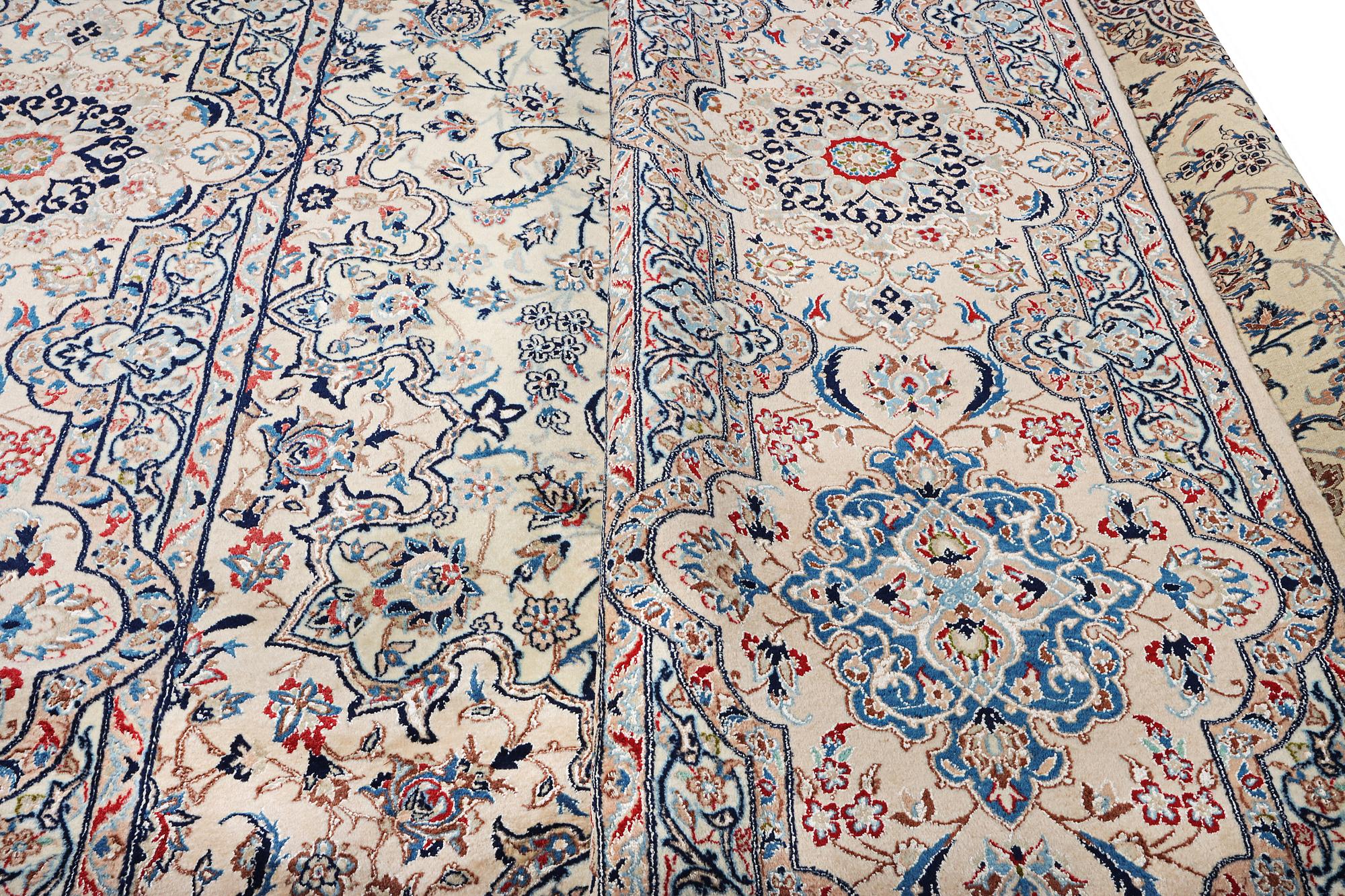 A Nain carpet, part silk, 9 laa, c. 453 x 298 cm.