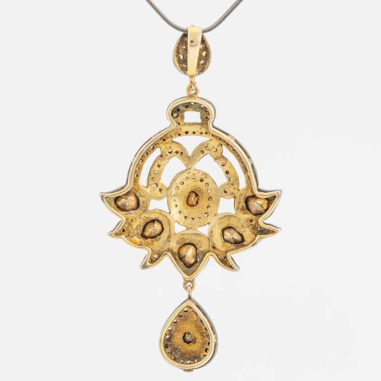 A faceted diamond necklace.