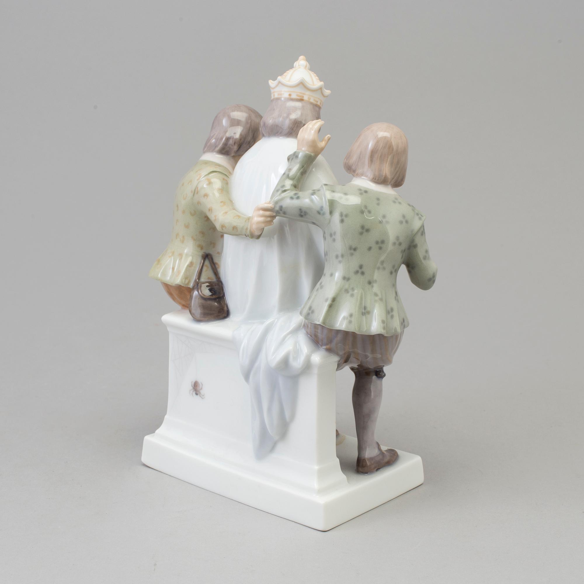 A Royal Copenhagen porcelain figure group, 'Emperors new clothes', Denmark, 1920s.