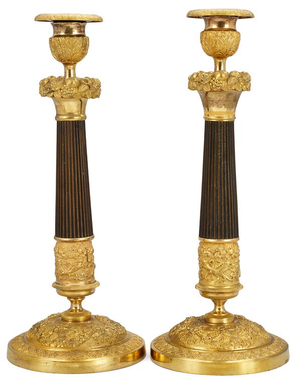 A pair of late empire candlesticks.