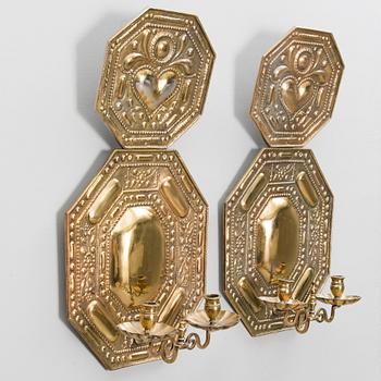 A pair of bronze wall scones from the early 20th Century.