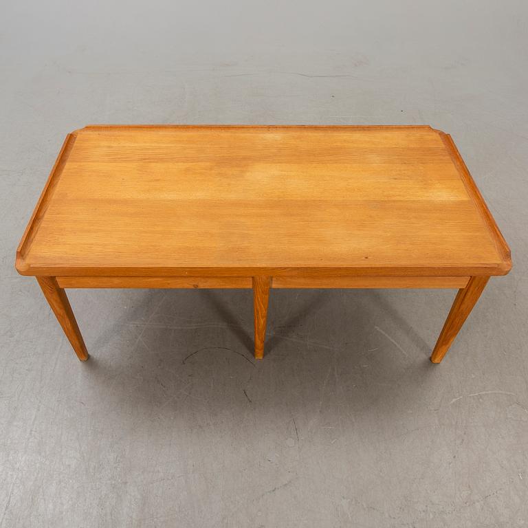 A 1960s oak coffee table.