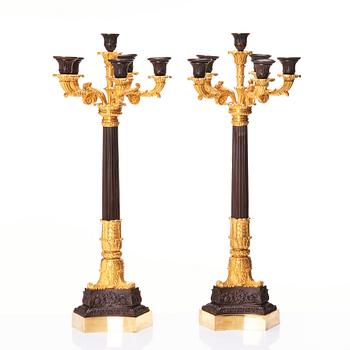 A pair of French Louis Philippe six light candelabra, around 1830.