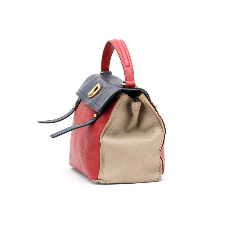 YVES SAINT LAURENT, a beige, red and blue leather handbag, "Muse two".