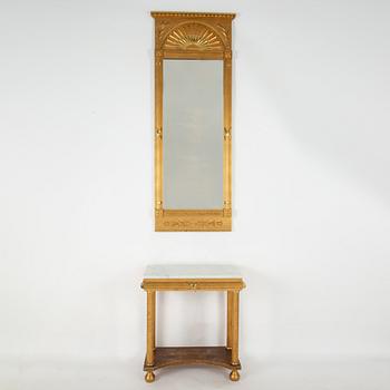 An Empire style mirror and a console table, first half of the 20th century.