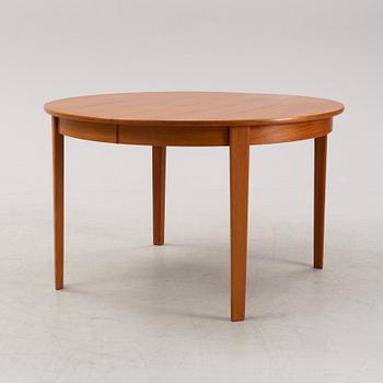 A 1950's/60's teak-veneered dining table.