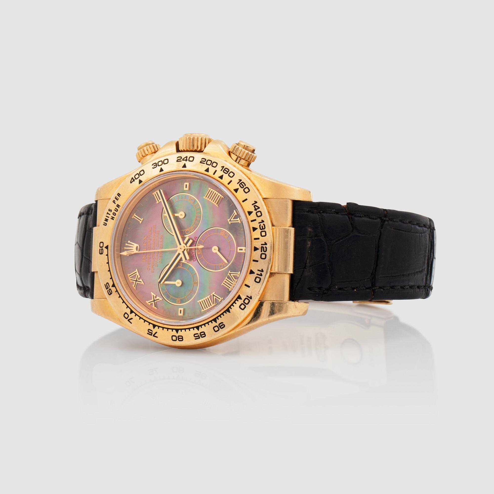 HERRUR, Rolex Daytona Cosmograph. Automatisk. Pärlemotavla. Ø 40 mm. Boett och spänne i 18K guld.