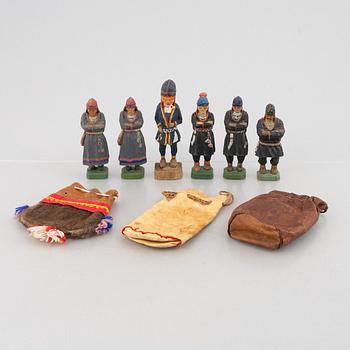 Five carved figurines by Lars Enarsson and one by Georg Jonsson, three leather pouches.