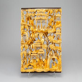 A Chinese wooden and lacquered wood panelm early 20th century.