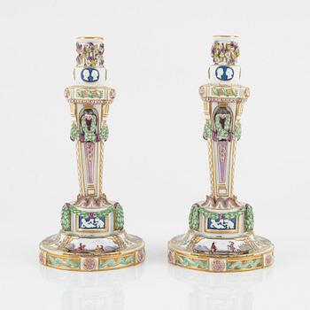 A pair of Meissen candle sticks, circa 1900.